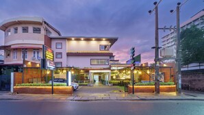 A hotel with a modern facade, a covered entrance, and a well-lit outdoor area. - Beach Corridor Residence (Negombo)