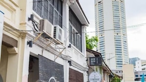 A street view with a building featuring a sign for 'ZOU ZOU' and 'LORONG Life'. - Kangsar Inn 73 (George Town)
