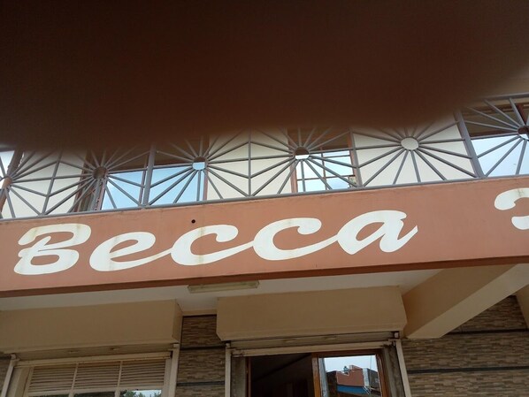 A building with a sign that reads "Becca". - Becca Hotel Meru (Meru)