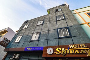 A multi-story building with a sign for 'fab hotels' and 'Hotel Shivaa'. - Fabhotel Shivay (Indore)