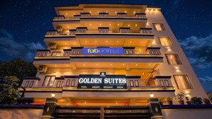 A multi-story hotel with balconies, a pool, banquet, restaurant, and room amenities. - Fabhotel Golden Suites Near Puri Beach (Puri)