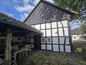 Outdoor dining - Historic half-timbered house from the 18th century, listed building (Hennef)