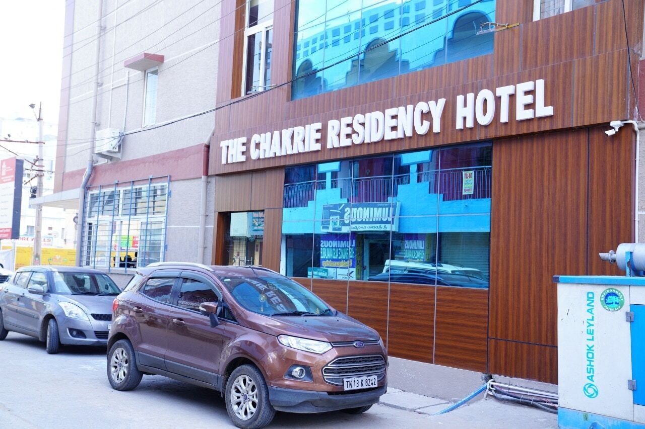 A building with a sign reading "The Chakrie Residency Hotel".