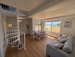 Smart TV - Princes Beach Cottage, outdoor entertainer, sea views, BBQ & fireplace (Ledge Point)