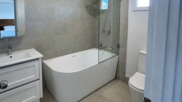 Shower, hair dryer, towels, soap