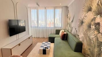 32-inch flat-screen TV with satellite channels