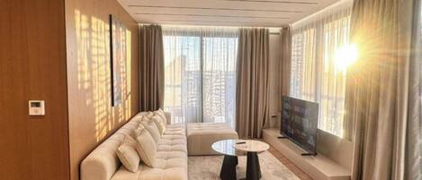 Apartment, Balcony, City View | Living area | 32-inch flat-screen TV with satellite channels
