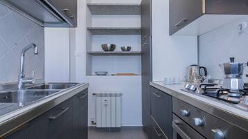 Fridge, oven, electric kettle, cookware/dishes/utensils