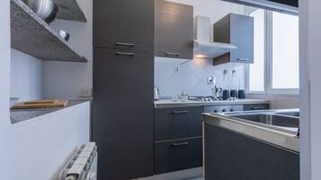 Fridge, oven, electric kettle, cookware/dishes/utensils