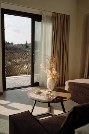 Suite de lujo, 2 habitaciones | Área de sala de estar