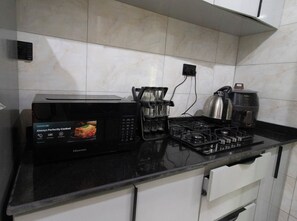 Microwave, oven, stovetop - Luxury New 2-Bedroom Apartment, 5-Min Walk to Elegushi Beach”. (Lekki)