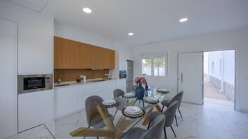 Dishwasher, coffee/tea maker, cookware/dishes/utensils