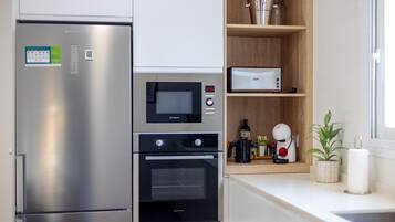 Dishwasher, coffee/tea maker, cookware/dishes/utensils