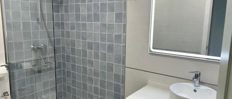 Shower, hair dryer, towels, soap