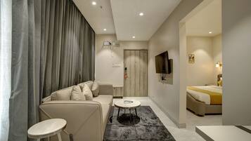Signature Studio Suite, 1 Bedroom, Balcony, City View | Premium bedding, minibar, individually furnished, desk