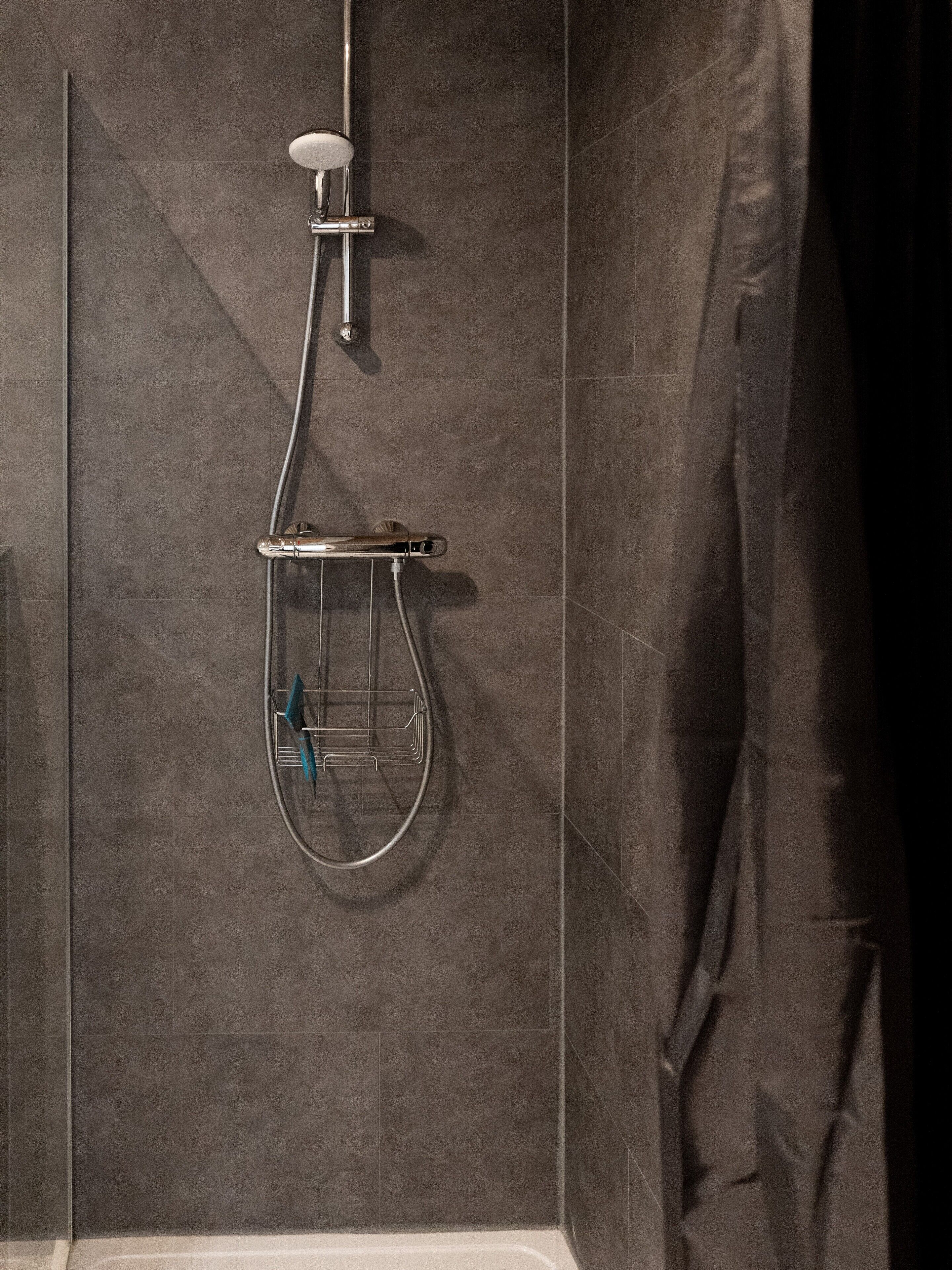Shower, hair dryer, towels, toilet paper