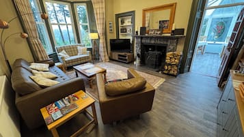 42-inch LED TV with satellite channels, books, video library