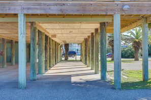 A covered walkway with wooden pillars, leading to a building entrance. - Boat, Swim, Walk to Beach! Dauphin Island Retreat (Dauphin Island)