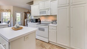 A kitchen with white cabinetry, a microwave, an oven, and a toaster. - 2 Mi to Pinehurst Resort: Spacious Golf Getaway! (Pinehurst)