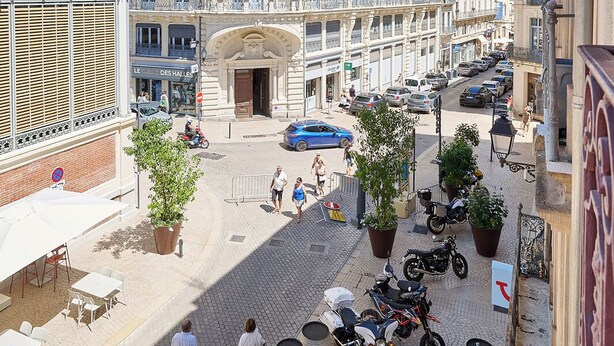 A historic building with ornate architecture, a central courtyard, and outdoor seating areas. -  Le Gratien by Béziers 1609 Résidences (Béziers)