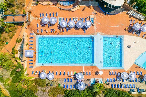 Seasonal outdoor pool, pool umbrellas, pool loungers