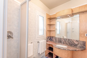 Shower, rainfall showerhead, bidet, towels