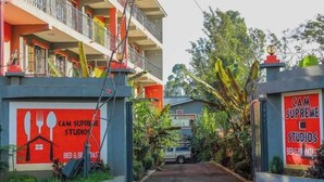 A building with a sign for 'Cam Supreme Studios' indicating it offers bed and breakfast services. - Camsupreme Studios Meru  (Meru)