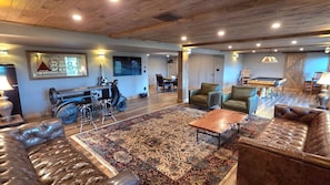 Lower level entertainment area with poker table, pool table, etc.
