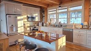 Primary kitchen is fully stocked with cookware and appliances.