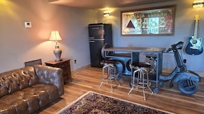 Lower level entertainment area with poker table, pool table, etc.