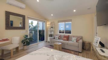 Apartment, 1 King Bed with Sofa bed, Patio, Garden View (Monarch Cove - C) | Living area