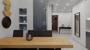 A modern dining area with a wooden table, dark chairs, and a decorative wall with woven baskets. - Acropolis Deluxe Apartment, Apartment (Athens)