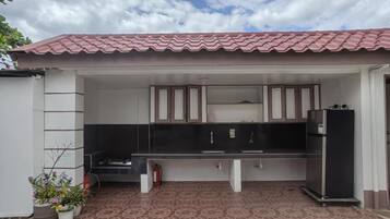 Fridge, stovetop, cookware/dishes/utensils, dining tables