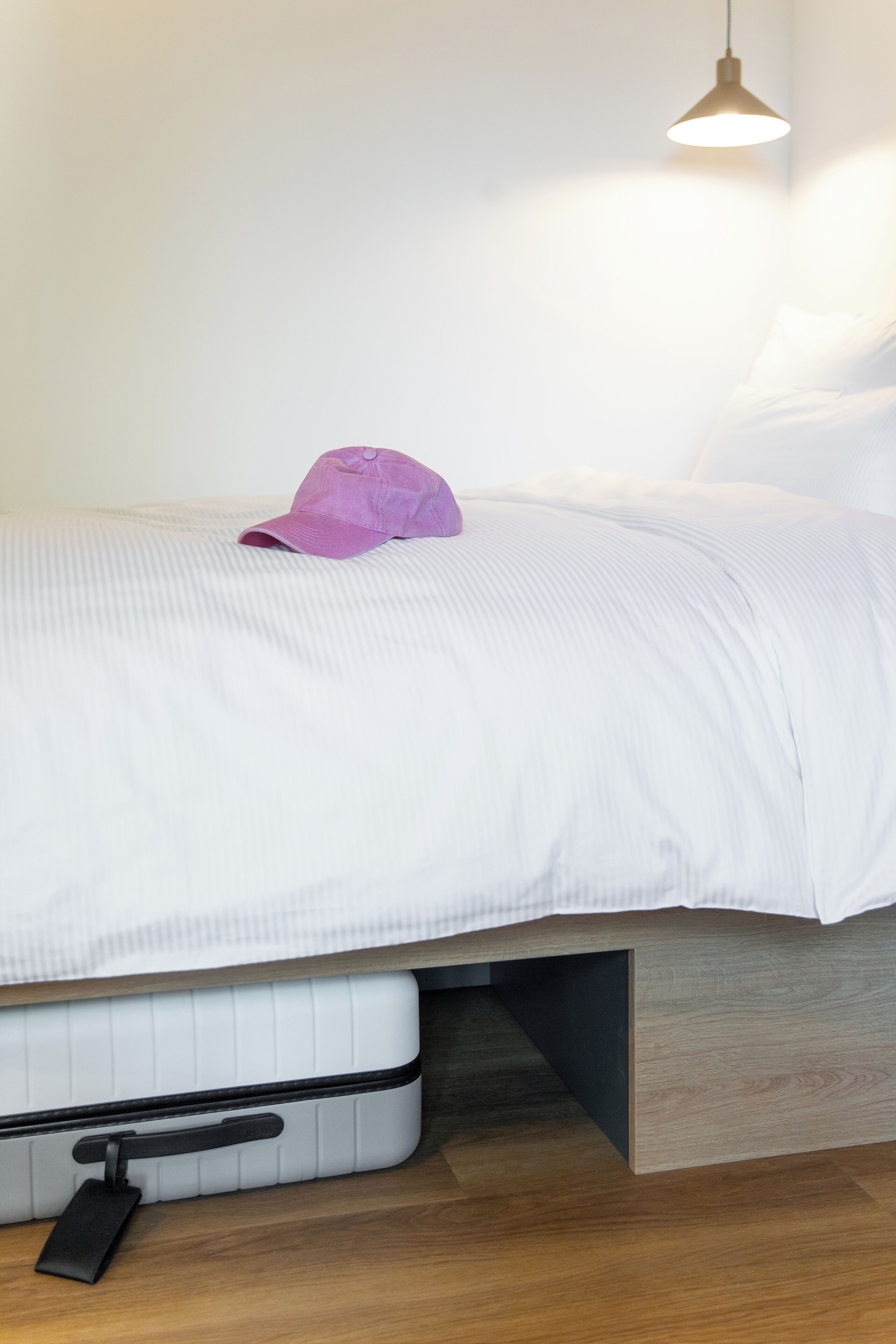 Premium bedding, desk, laptop workspace, blackout drapes