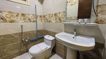 Slippers, bidet, towels, soap