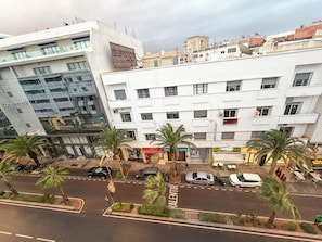 A multi-story building with a modern architectural style, featuring a mix of commercial and residential spaces. - Exceptional apartment, In the heart of avenue Hassan 2 (Agadir)