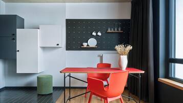 Design Apartment, 1 King Bed | Living area | 30-inch flat-screen TV with cable channels