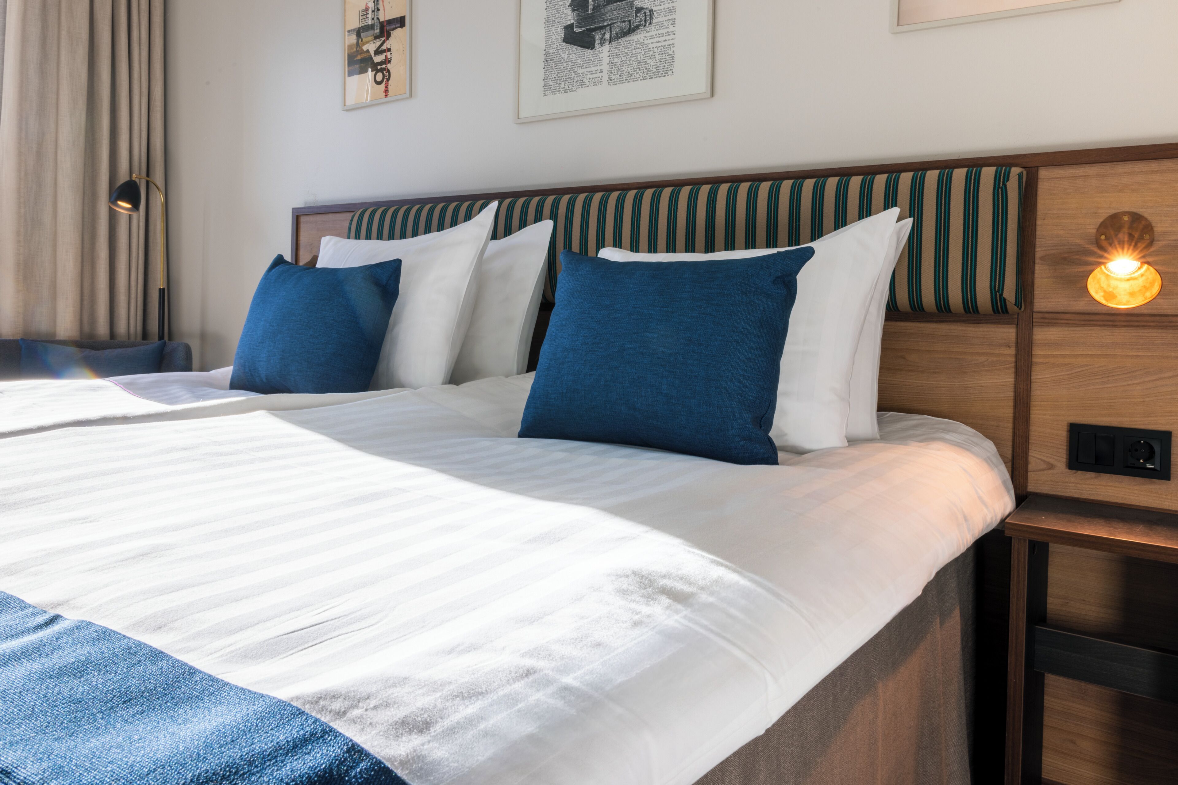 Hypo-allergenic bedding, desk, laptop workspace, blackout drapes