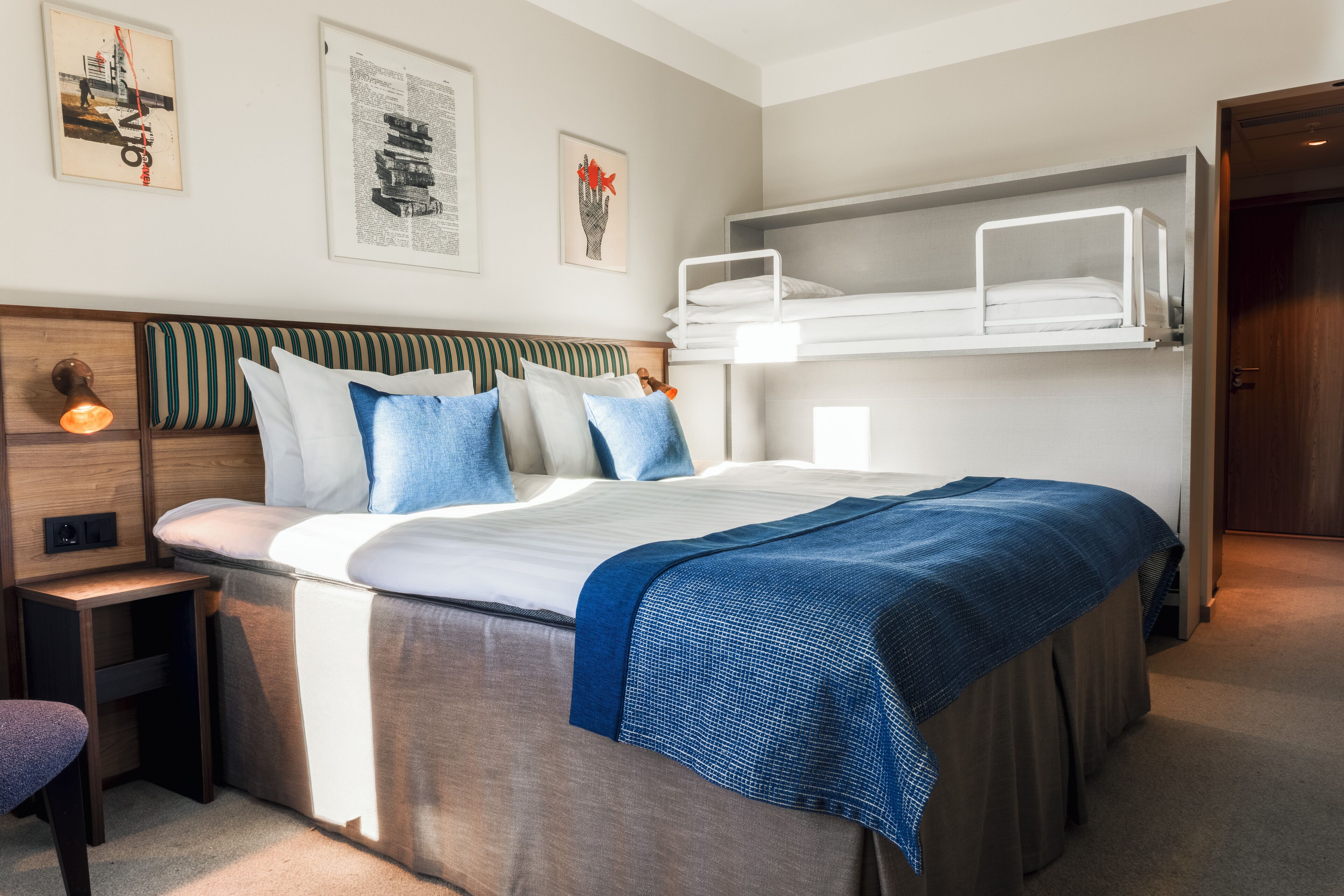 Hypo-allergenic bedding, desk, laptop workspace, blackout drapes