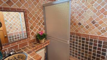 Shower, towels, soap, toilet paper