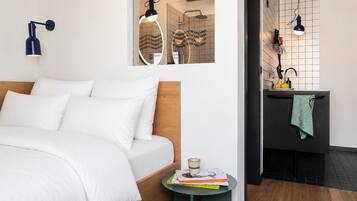 Premium bedding, desk, laptop workspace, soundproofing