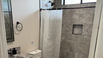 Shower, towels, soap, toilet paper