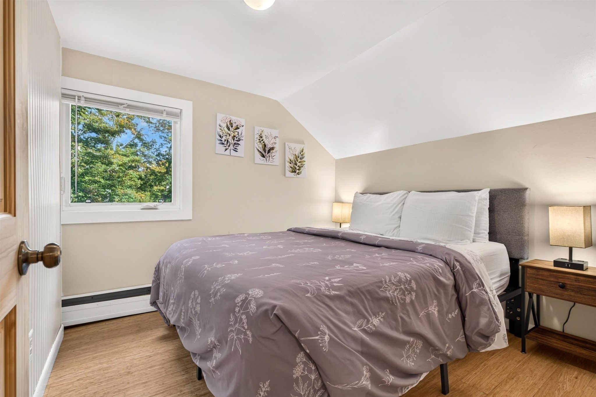 Wake up to your own serene retreat, where soft natural light fills the room and peaceful tree views greet you each morning.