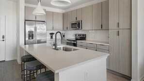 Fridge, dining tables - Landing | Stylish 1BD, Pool, Gym (Perdido Key)