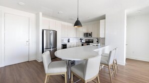 Fridge, dining tables - Landing | Modern 2BD in Downtown Roanoke (Fort Worth)