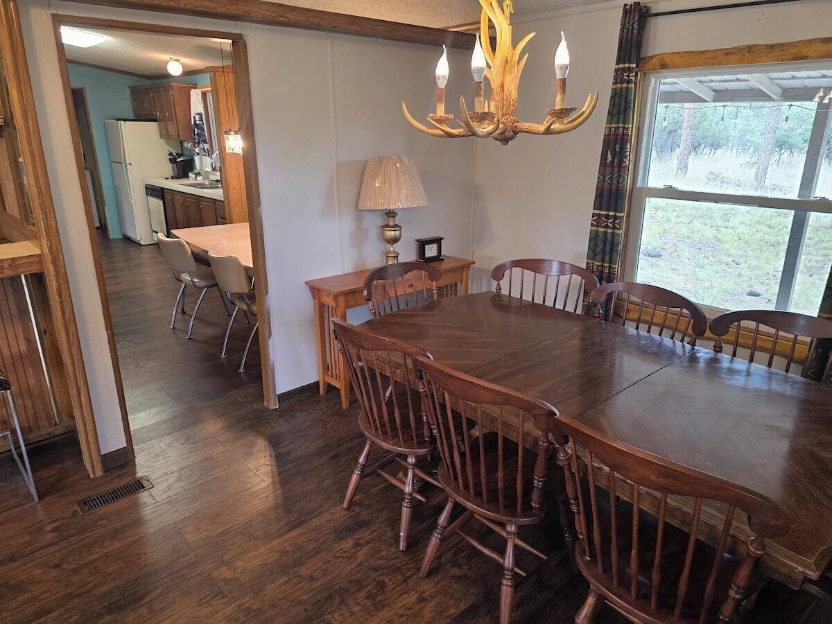 Dining area with a wood table seating six.