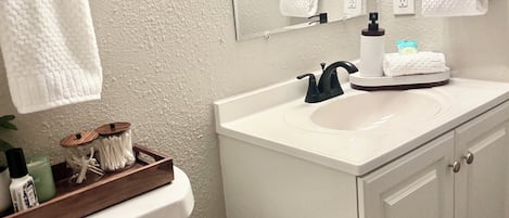 Hair dryer, towels, soap, toilet paper
