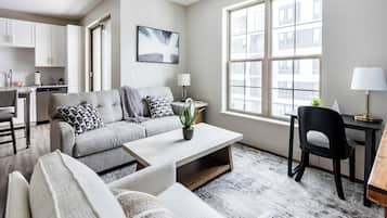 Standard Apartment (1 Bedroom) | Living area | 50-inch Smart TV with digital channels