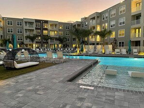 Outdoor pool - Landing Apartments near Edison Park Historic District (Fort Myers)