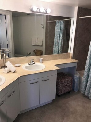 Shower, hair dryer, towels, toilet paper